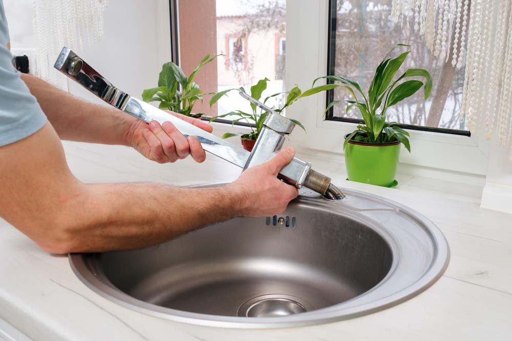 plumber replacing old faucet plumber replacing old faucet