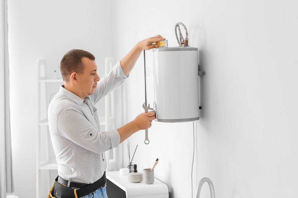 plumber installing water heater
