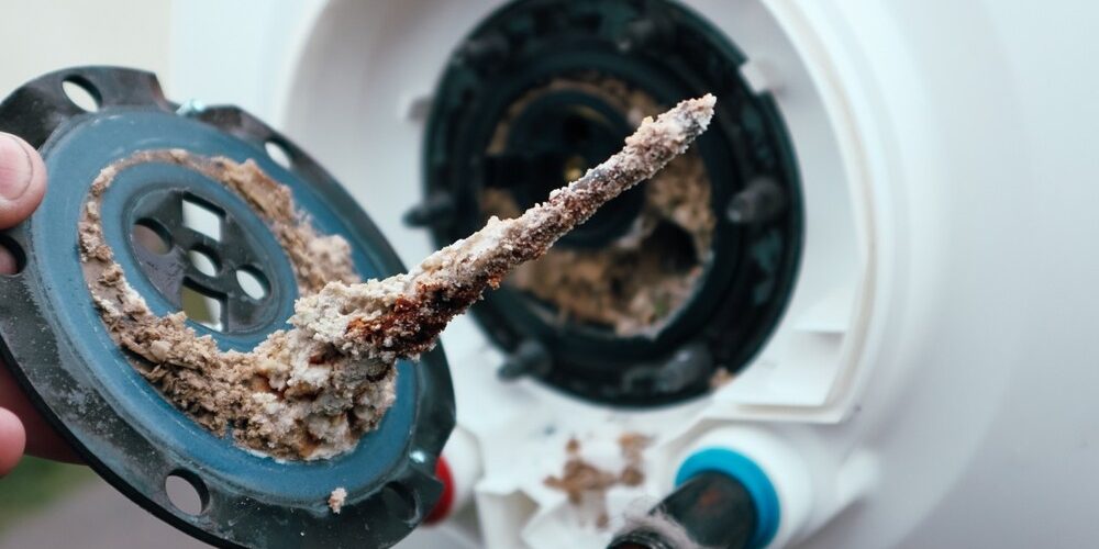 Sediment buildup in water heater tank Sediment buildup in water heater tank